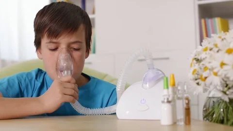 Boy using nebuliser inhaler with mask, allergy and asthma concept Stock Footage 80145219