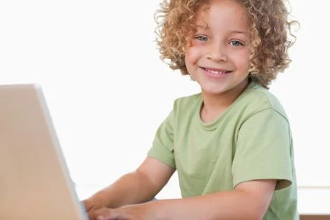 Boy using a notebook Stock Photos