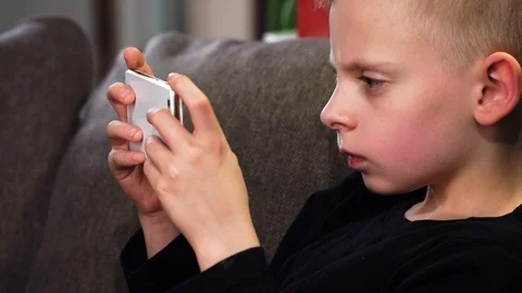 Boy Using Phone Stock Footage 87498976