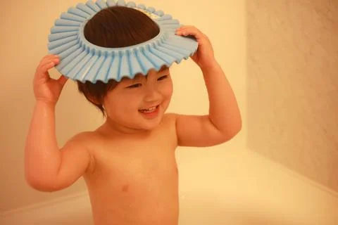 Boy using shampoo hat Stock Photos