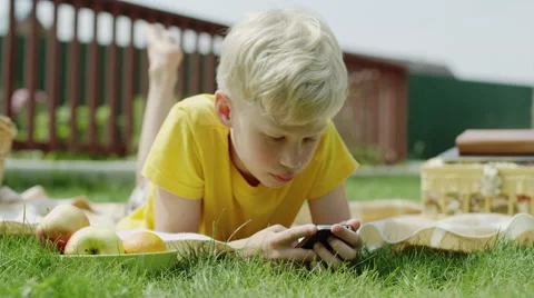 Boy using smart phone Stock Footage 66538521