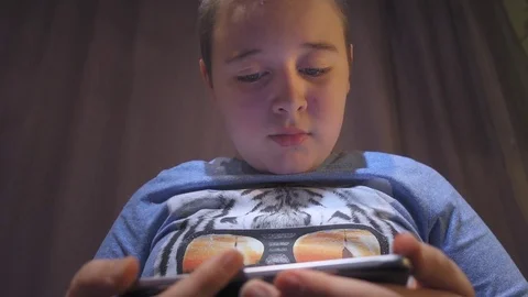 Boy using smartphone Stock Footage 73258950