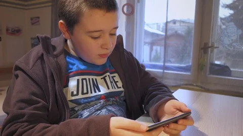 Boy using smartphone Stock Footage 73259013