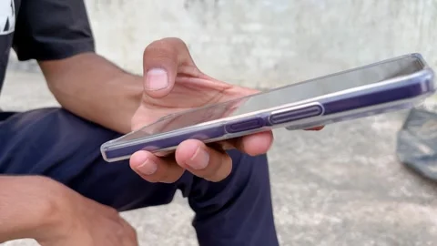 Boy Using Smartphone on Rooftop Stock Footage 321515578