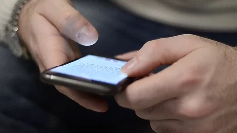 Boy using a smartphone to shop online from home in Milan, Italy Stock Footage 76104466