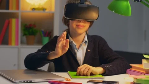 Boy using social network in virtual reality goggles Stock Footage 98557366