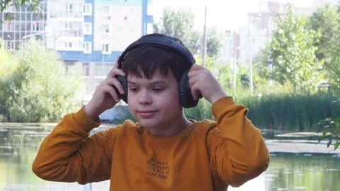 Boy using tablet computer, teenager relaxing in the park Video stock 270937021