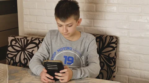 Boy is using tablet Stock Footage 147330565