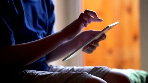 Boy using tablet at home Stock Footage 78720102