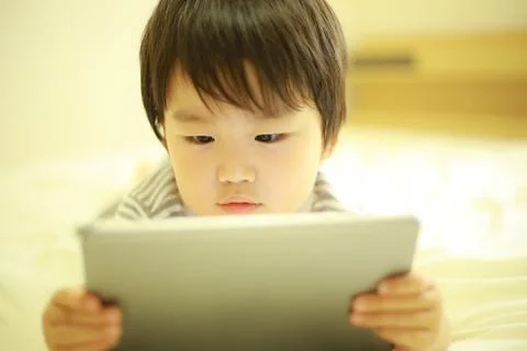 Boy using a tablet Stock Photos