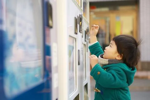 Boy using vending machine Stock Photos