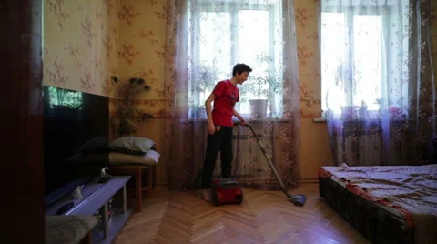 Boy Vacuuming Apartment Stock Footage 63613222