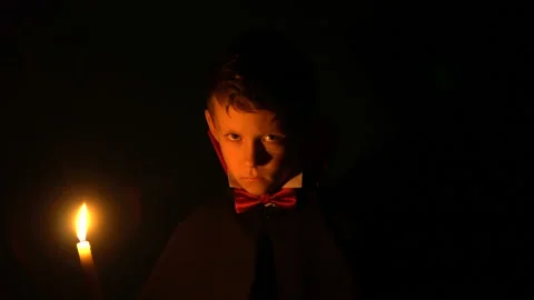 Boy in vampire costume posing for camera, makeup as evil spirits on Halloween Vídeo Stock 97954611