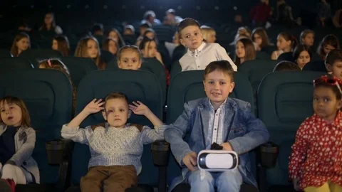 Boy in virtual glasses, closeup shot at the cinema Stock Footage 75991612