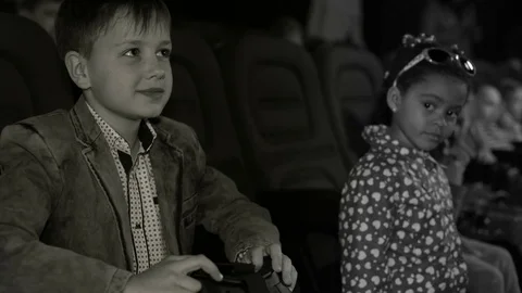 Boy in virtual glasses, closeup shot at the cinema. Black and white footage Stock Footage 75991928