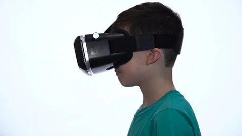 The Boy in the Virtual Reality Device on a White Background Video stock 70065584