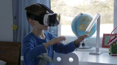 Boy in virtual reality glasses playing 360 degree game - 4k Stock Footage 80263976