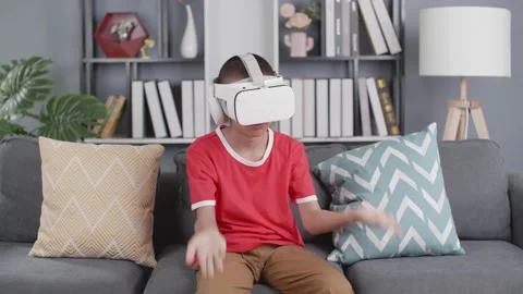 The boy with virtual reality headset is stunned by VR experience Stock Footage 158004812