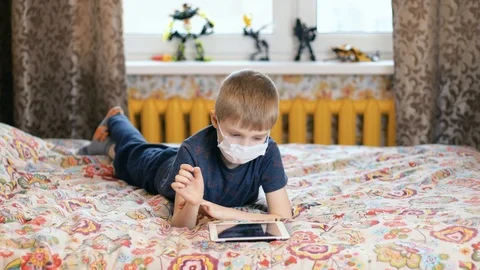 A boy with a virus using tablet Stock Footage 127411153