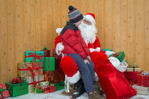 Boy visiting santas grotto Stock Photos