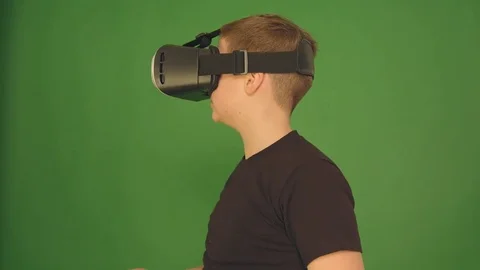 Boy in VR glasses. closeup shot. The boy looks emotionally virtual glasses 動画素材 84634989