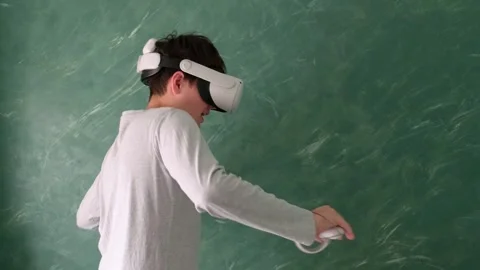 A boy in vr headset Stock Footage 252116026