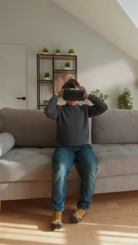 Boy With VR Headset Waving Hello Stock Footage 335476549