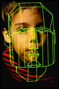 Boy w. computer graphics of his face superimposed . Stock Photos