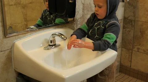 Boy wahing hands Stock Footage 50147159