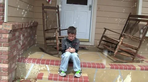 Boy waiting for snow to stop 2 Stock Footage 10890815