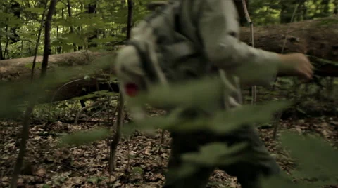 BOY WALK THROUGH THE FOREST Stock Footage 68755754
