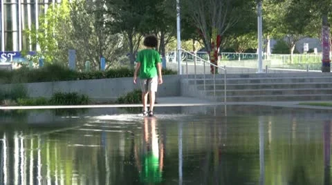 Boy Walking Across Water Video stock 10586583