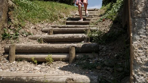 Boy walking down log stairs, beach stairs 스톡 동영상 112081259