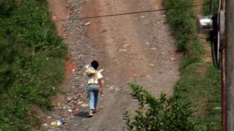 Boy walking up hill, Guatemalan Village Stock Footage