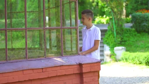 Boy walking near the building Stock Footage 149002115