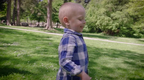 Boy walking in park Stock Footage 64453362