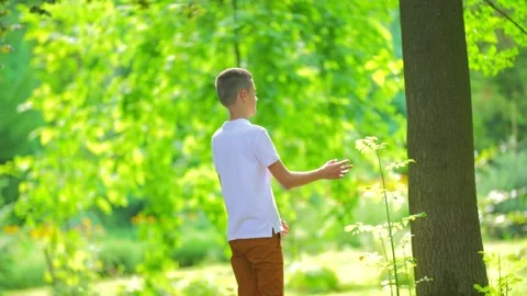 Boy walking in the park Stock-Footage 139609743