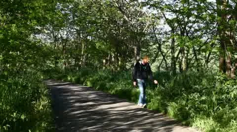 A boy walking in a path (front view) Stock Footage 11115547