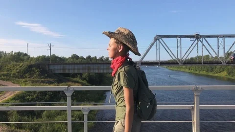 Boy Walking On Railway Bridge Video stock 79498273