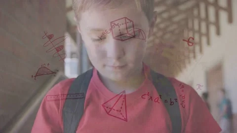 Boy walking school corridor looking phone and causing math overlays around phone Stock Footage 334351982