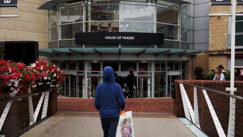 Boy walking into a shopping center Stock Footage 112729960