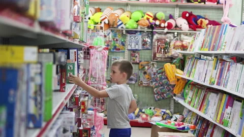 Boy walking in toy shop. Stock Footage 268245801