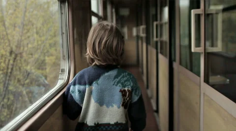 BOY WALKING IN THE TRAIN Stock Footage 68755698