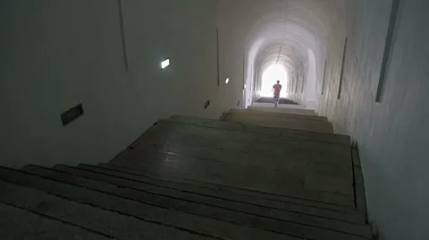 Boy walking in underground tunnel Stock Footage 53047460