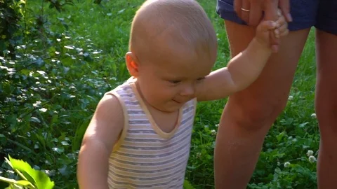 The boy is walking with yellow flowers Stock Footage 79935647