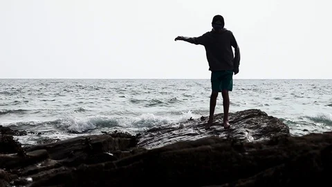 A boy walks on the beach Stock Footage 94407966