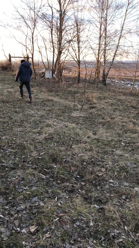 The boy walks in the garden Stock Footage 172072398
