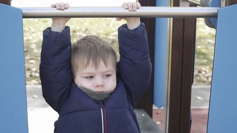 A boy walks on a playground Stock Footage 140754836