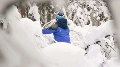 A boy walks through the snow-covered forest Ukraine Stock-Footage 57335592