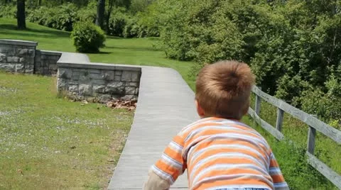 Boy on a wall Stock Footage 10911577